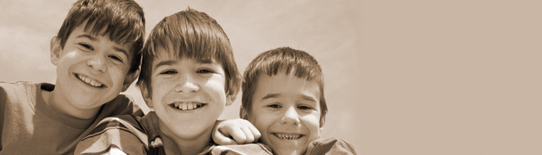 three boys smiling